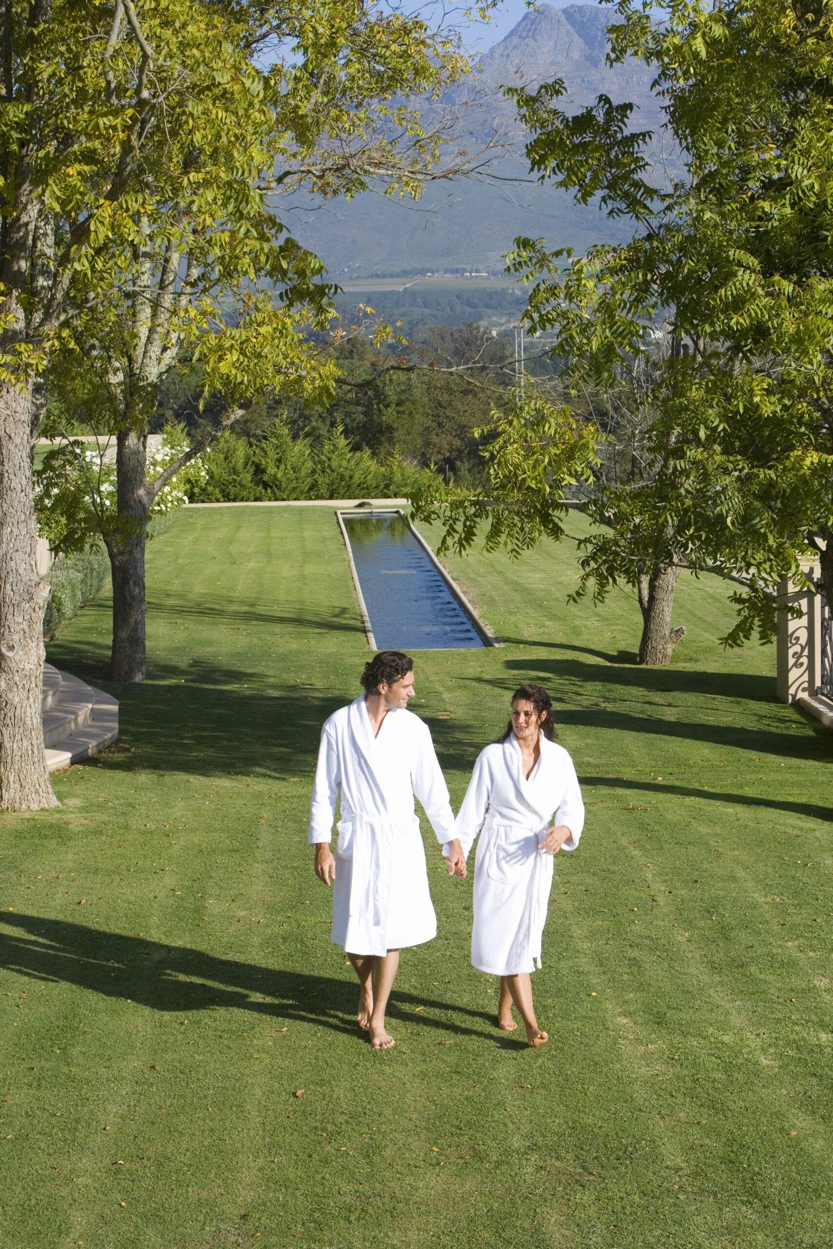 A couple in bathrobes at a hotel resort